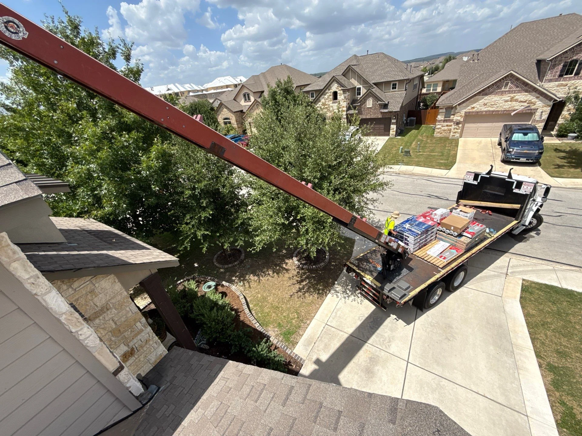 Roofing materials being delivered to a Revamped project