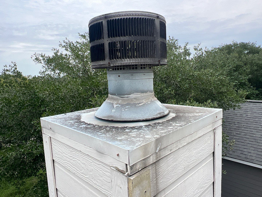 Rooftop vent inspected for hail damage