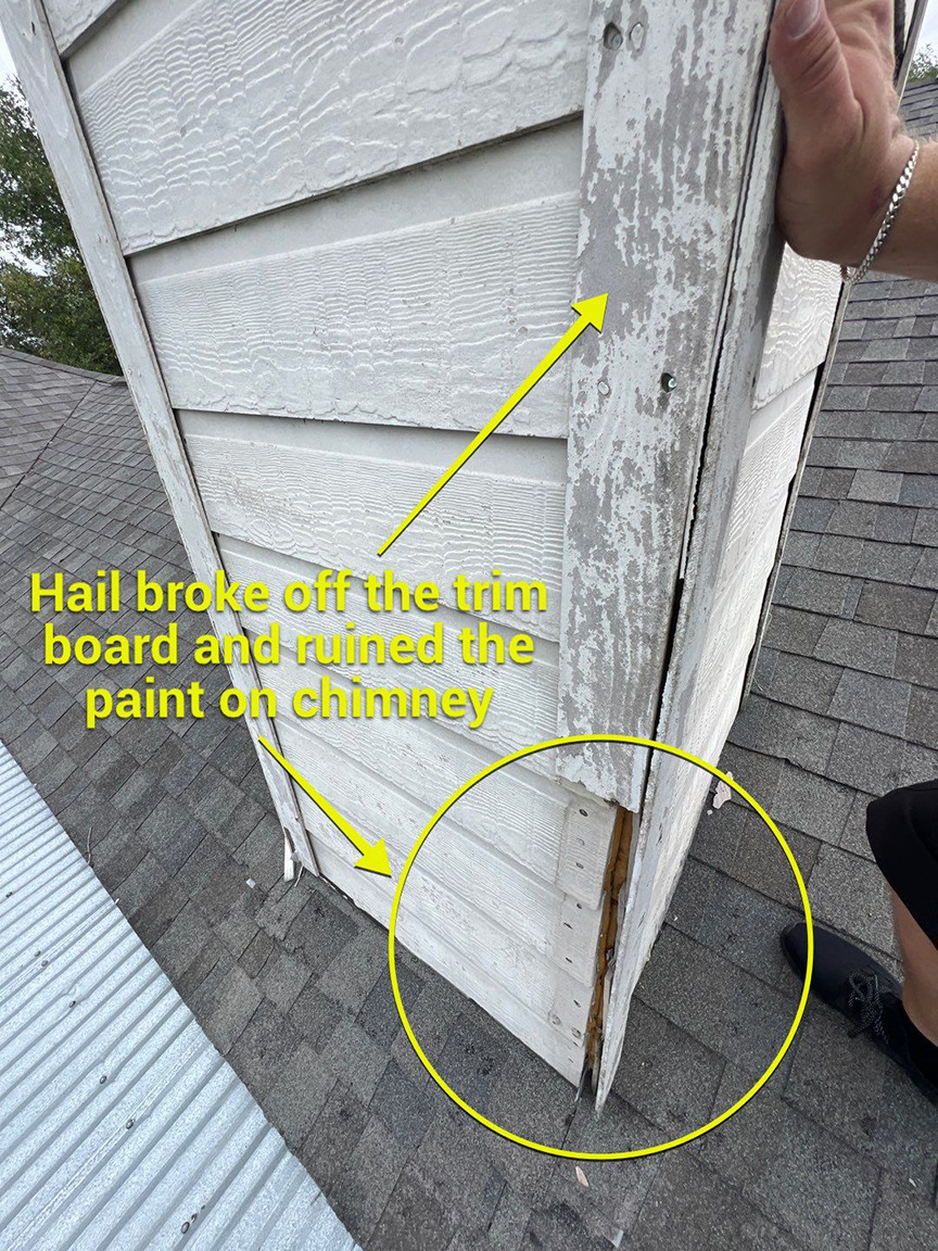 Hail and paint damage marked on exterior trim