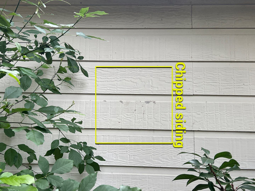 Chipped siding identified during a property inspection