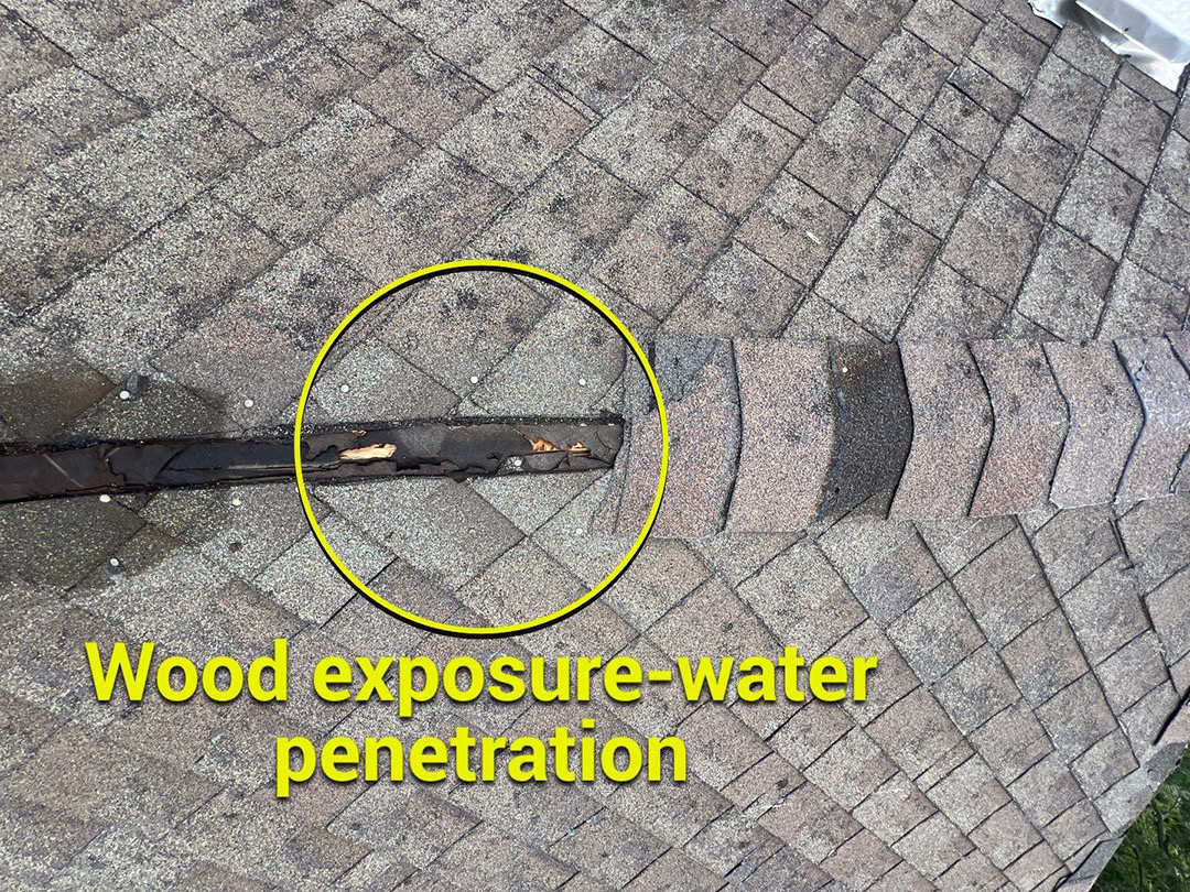 Exposed wood and water entry point at a roof hip